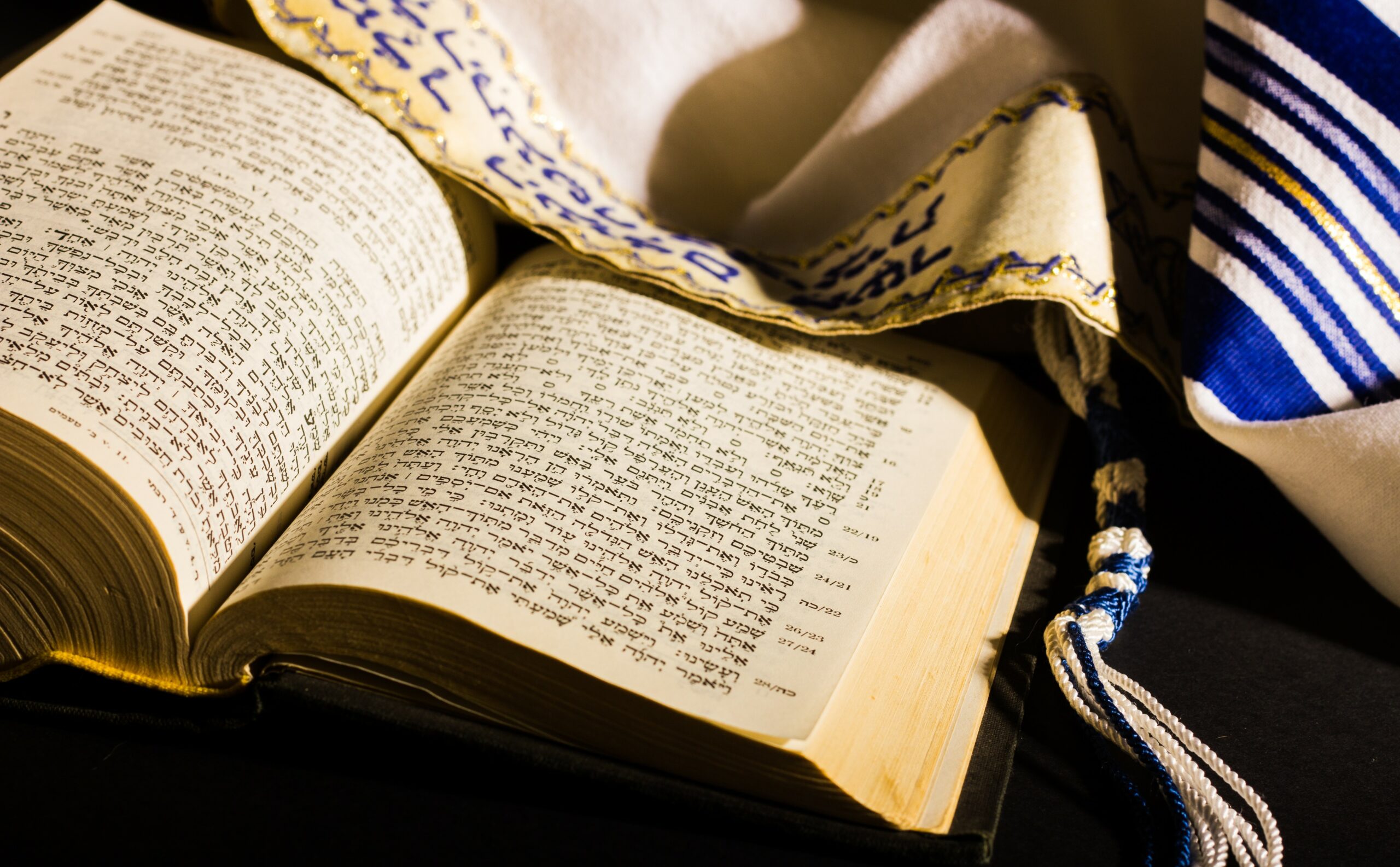 Alicante, Spain - April, 2019: Hebrew Bible and a tallit, a jewish prayer shawl