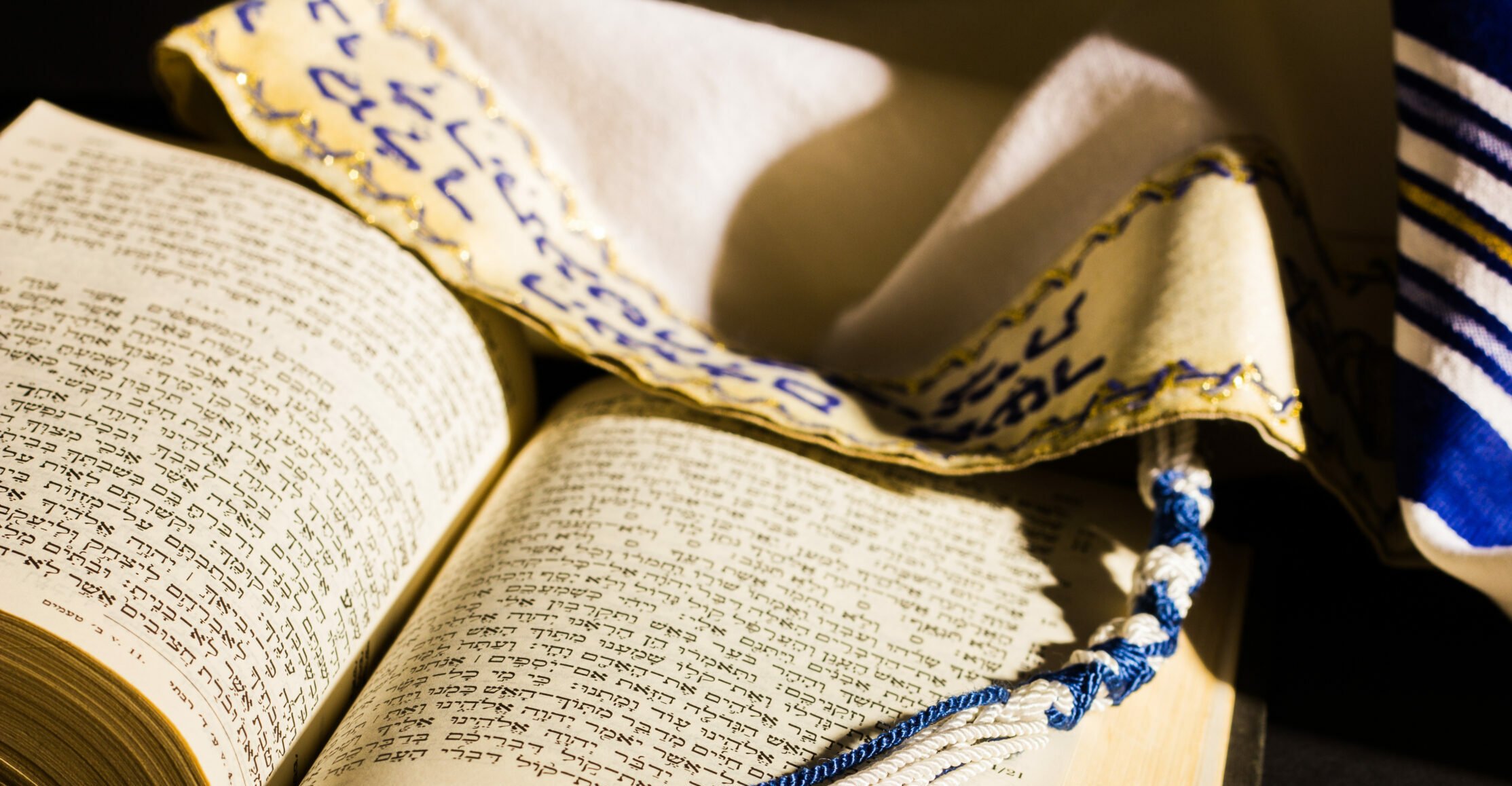 Hebrew prayer book and a tallit, a jewish prayer shawl