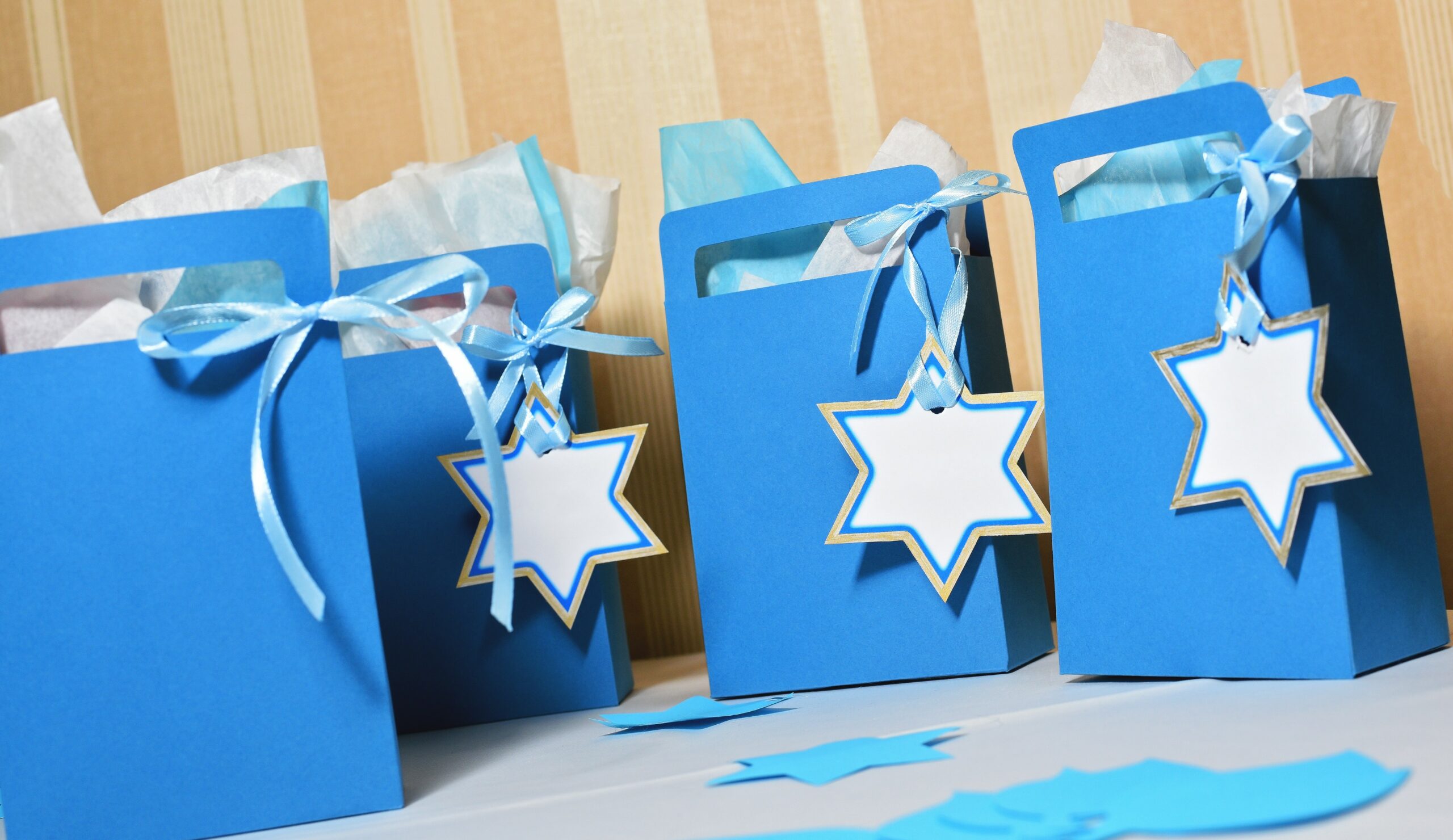 jewish presents in blue paper bags decorated with Star of David