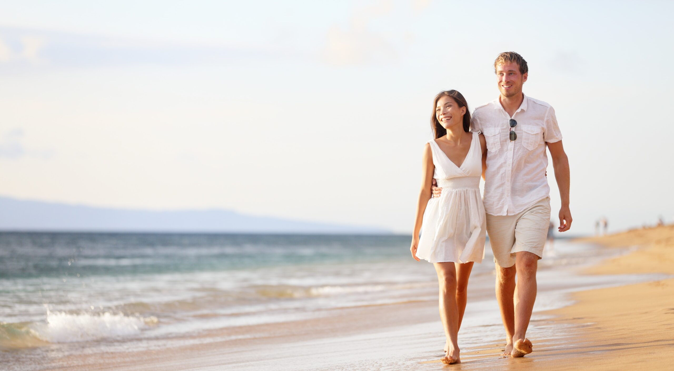 Couple walking on beach