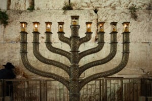 The official Hanukkah menorah of the Western Wall in Jerusalem, alight with all eight candles burning on the final night of the eight-day festival.