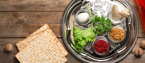 Flat lay composition with symbolic Passover (Pesach) items on wo