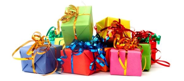 Colorful gifts with shining ribbons on white